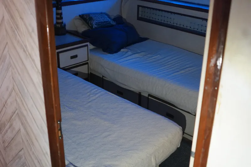 Slide: The Image of Interior cabin of a 1977 Bertram 46.6 yacht with twin beds. - 25