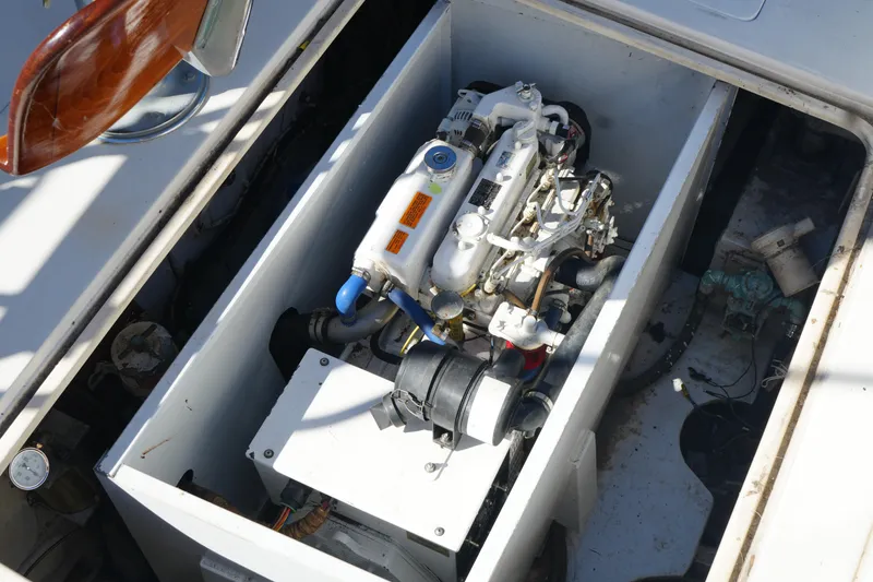 Slide: The Image of Engine compartment of a 1977 Bertram 46.6 boat, showcasing mechanical components. - 41