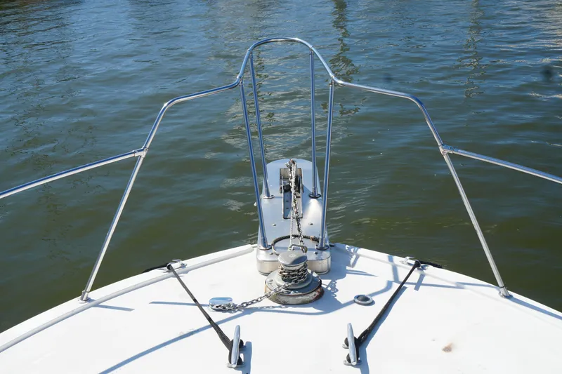 Slide: The Image of Bow of a 1977 Bertram 46.6 yacht with anchor chain and railing. - 5