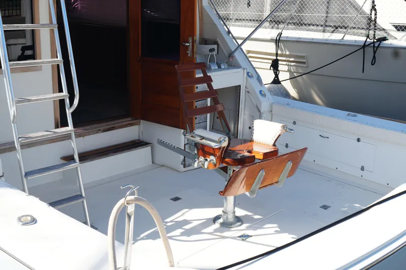 Slide: The Image of 1977 Bertram 46.6 yacht cockpit with fishing chair and ladder. - 8