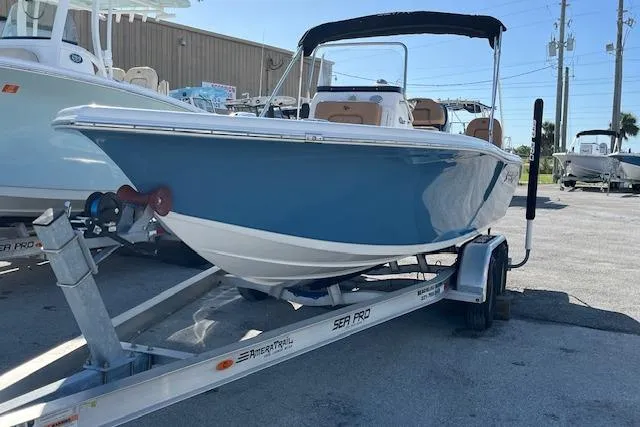 Slide: The Image of 2024 Sea Pro 199 Center Console boat on trailer, displayed outdoors. - 11