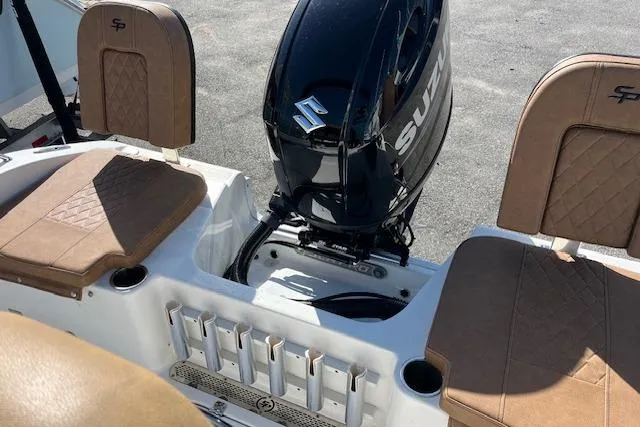 Slide: The Image of 2024 Sea Pro 199 Center Console boat with Suzuki outboard motor and tan seating. - 4