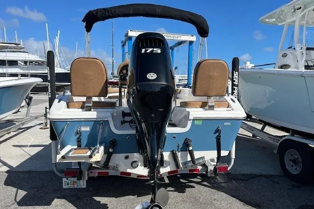 Slide: The Image of 2024 Sea Pro 199 Center Console boat with 175 HP engine at marina. - 8