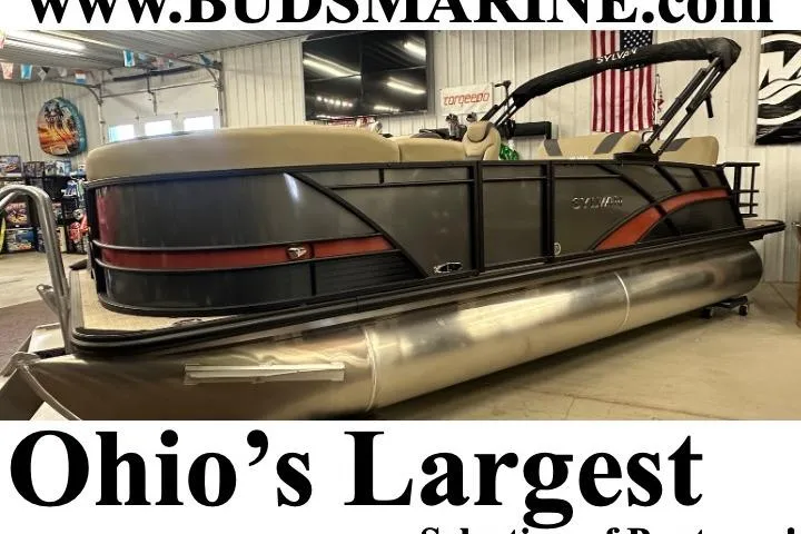 The Image of 2025 Sylvan L1 DLZ pontoon boat displayed at Bud's Marine in Ohio showroom. - 0