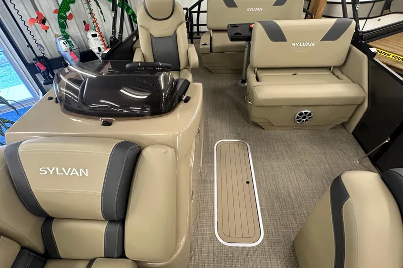 Slide: The Image of 2025 Sylvan L1 DLZ boat interior with beige seating and modern design. - 10