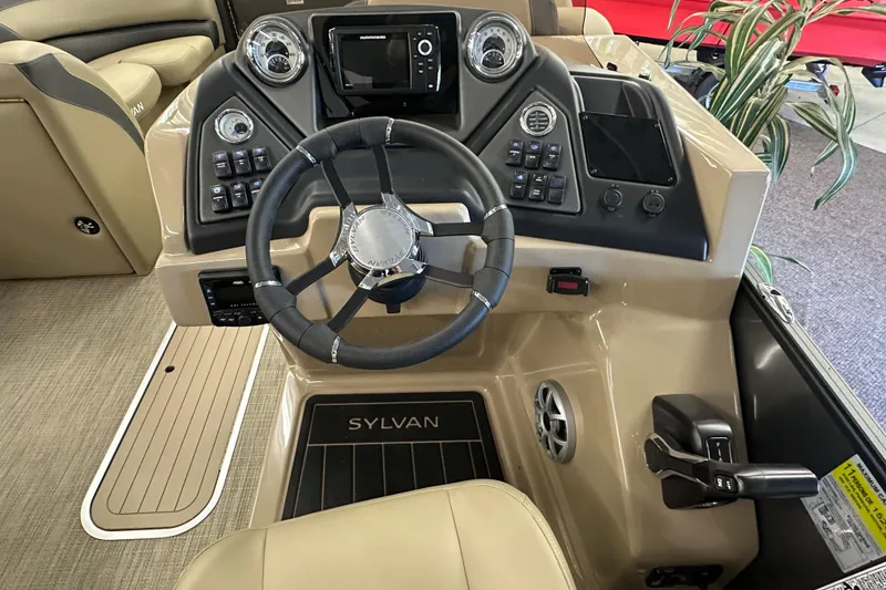 Slide: The Image of 2025 Sylvan L1 DLZ boat dashboard with steering wheel and control panel. - 13