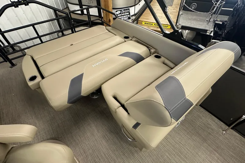 Slide: The Image of 2025 Sylvan L1 DLZ boat interior with beige and gray seating arrangement. - 20