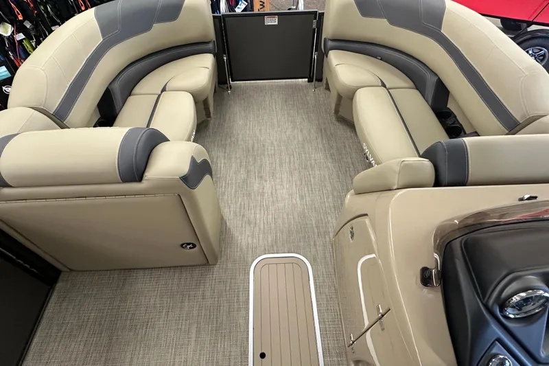 Slide: The Image of 2025 Sylvan L1 DLZ boat interior with beige and gray seating, spacious layout. - 4