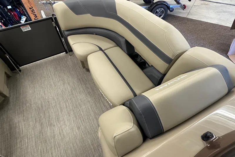 Slide: The Image of Luxurious interior seating of 2025 Sylvan L1 DLZ boat with beige and gray upholstery. - 5
