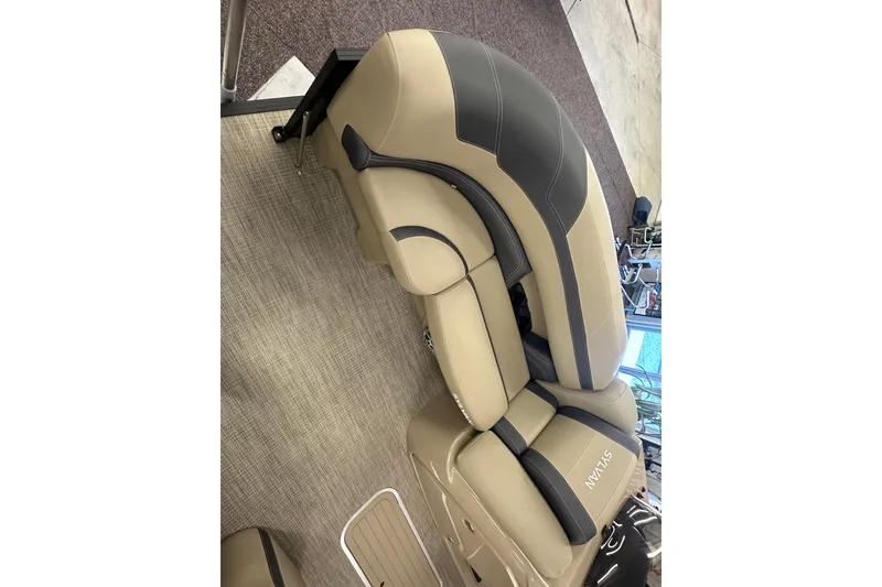 Slide: The Image of Luxurious seating in 2025 Sylvan L1 DLZ boat, featuring beige and black upholstery. - 9