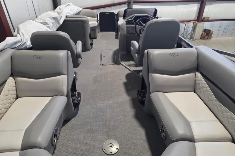 Slide: The Image of 2019 Manitou 23 Encore SHP pontoon boat interior with luxurious seating and modern design. - 11