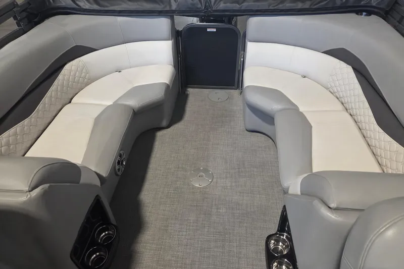 Slide: The Image of 2019 Manitou 23 Encore SHP interior with gray and white seating, carpeted floor. - 3