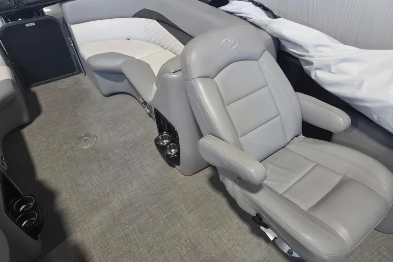 Slide: The Image of 2019 Manitou 23 Encore SHP interior with gray leather seating and modern design. - 5