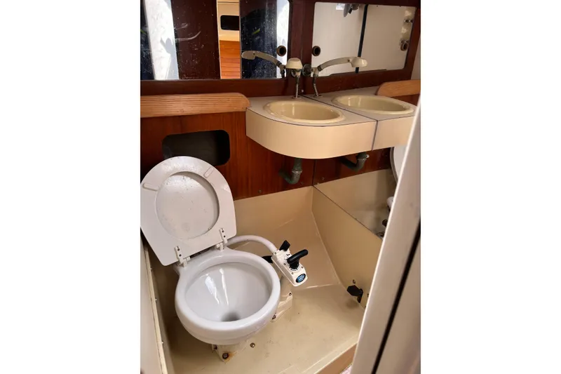 Slide: The Image of 1982 J Boats J/30 yacht bathroom with dual sinks and marine toilet. - 4