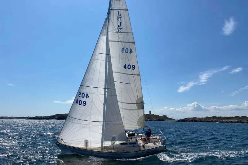 Slide: The Image of 1982 J Boats J/30 sailing on a sunny day with clear blue skies. - 8