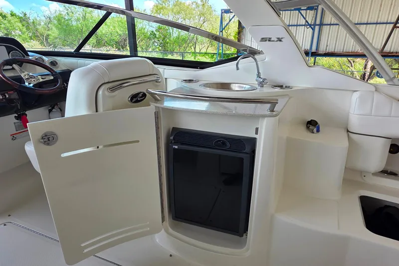 Slide: The Image of 2009 Sea Ray 270 SLX boat interior with sink and storage area. - 15