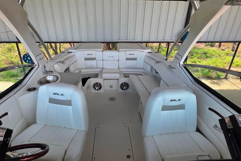 Slide: The Image of 2009 Sea Ray 270 SLX boat interior with white seating and modern design. - 21