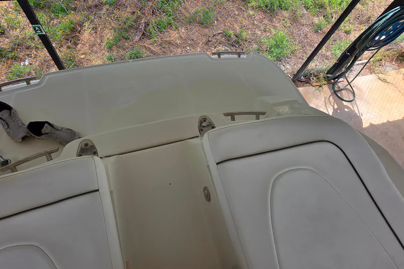 Slide: The Image of 2009 Sea Ray 270 SLX boat interior with seating and storage area. - 24