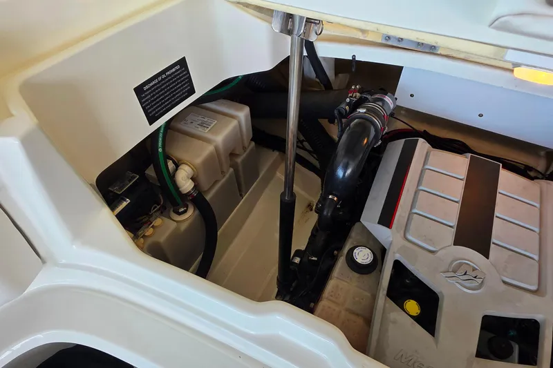 Slide: The Image of Engine compartment of a 2009 Sea Ray 270 SLX boat, showing mechanical components. - 26