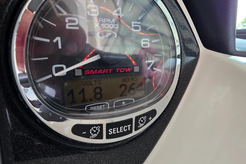 Slide: The Image of Close-up of 2009 Sea Ray 270 SLX tachometer displaying RPM, volts, and hours. - 27