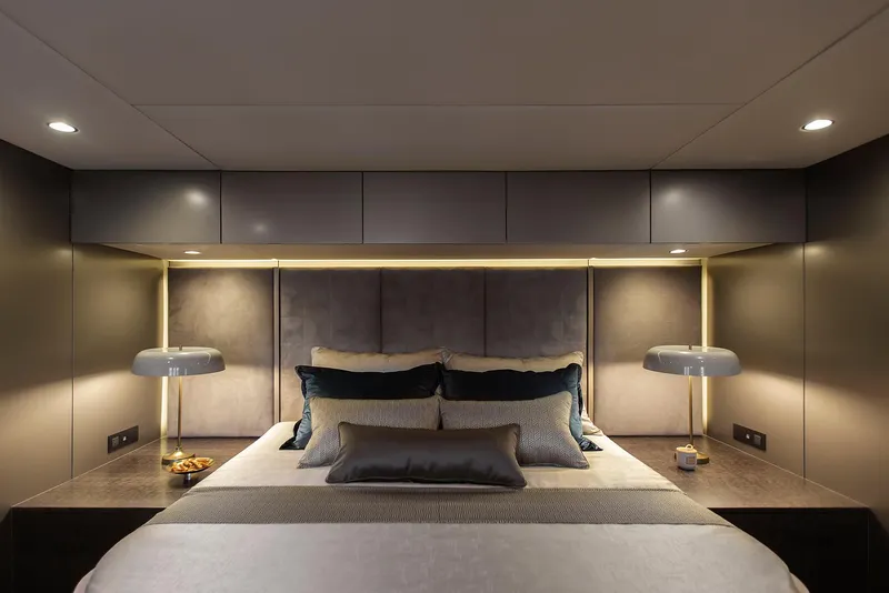 Slide: The Image of Luxurious bedroom interior of 2026 Sunreef 60 Sunreef Power yacht, featuring modern design and ambient lighting. - 14