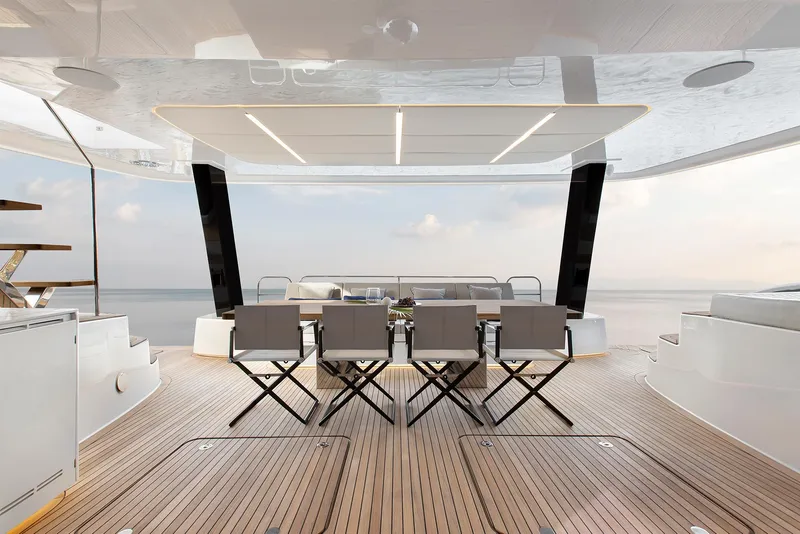 Slide: The Image of Luxurious deck of 2026 Sunreef 60 Power yacht with elegant seating and ocean view. - 4