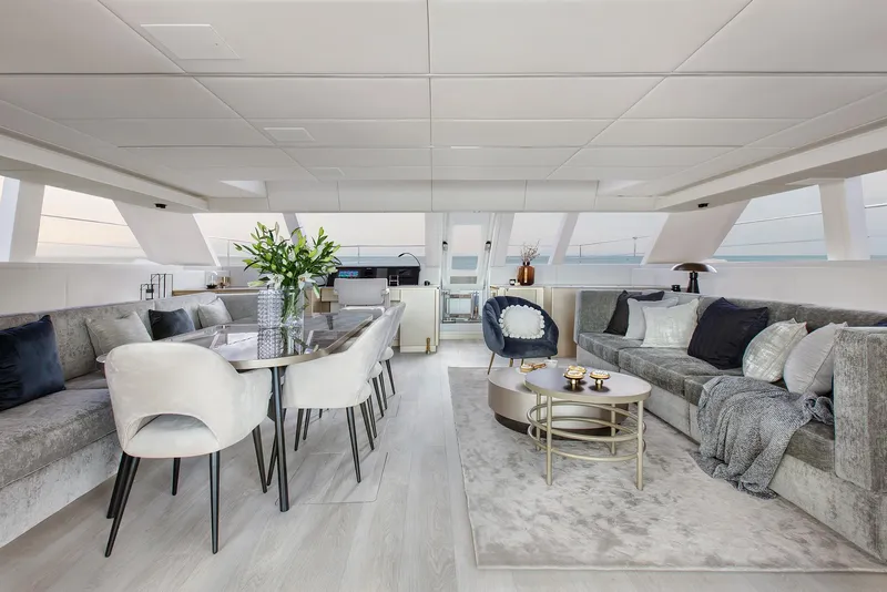 Slide: The Image of Luxurious interior of 2026 Sunreef 60 Power yacht with elegant dining and seating areas. - 6