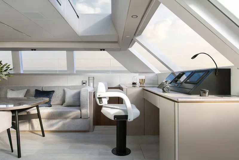 Slide: The Image of Luxurious interior of 2026 Sunreef 60 Power yacht with modern helm and seating area. - 8