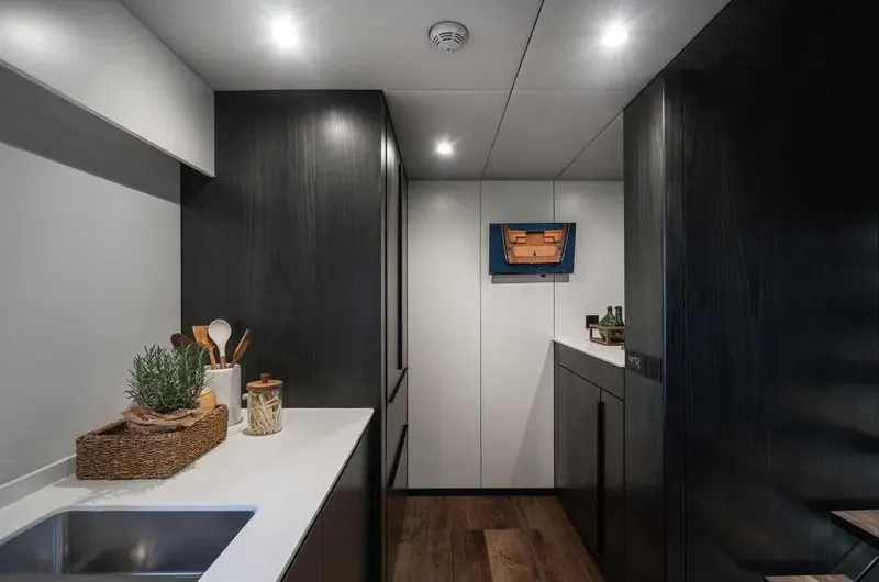 Slide: The Image of Modern kitchen interior of 2026 Sunreef 70 Sunreef Power yacht, featuring sleek design and ambient lighting. - 3