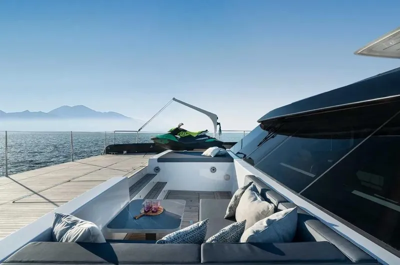 Slide: The Image of Luxurious 2026 Sunreef 70 Power yacht deck with seating, sea view, and jet ski. - 8