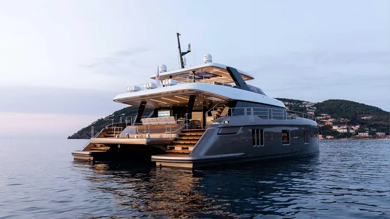 Slide: The Image of 2026 Sunreef 80 Sunreef Power yacht on calm water at sunset. - 11