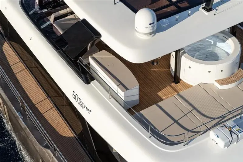 Slide: The Image of 2026 Sunreef 80 Power yacht deck with jacuzzi and seating area. - 16