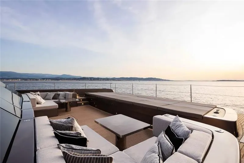 Slide: The Image of Luxurious deck of 2026 Sunreef 80 Sunreef Power yacht with ocean view at sunset. - 17