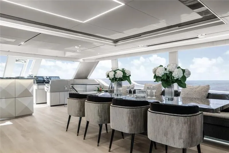 Slide: The Image of Luxurious interior of 2026 Sunreef 80 Power yacht with elegant dining area and ocean view. - 27