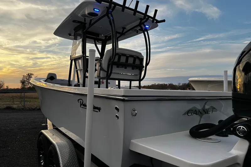 Slide: The Image of 2024 Pair Customs 24DV boat at sunset, featuring sleek design and modern features. - 5