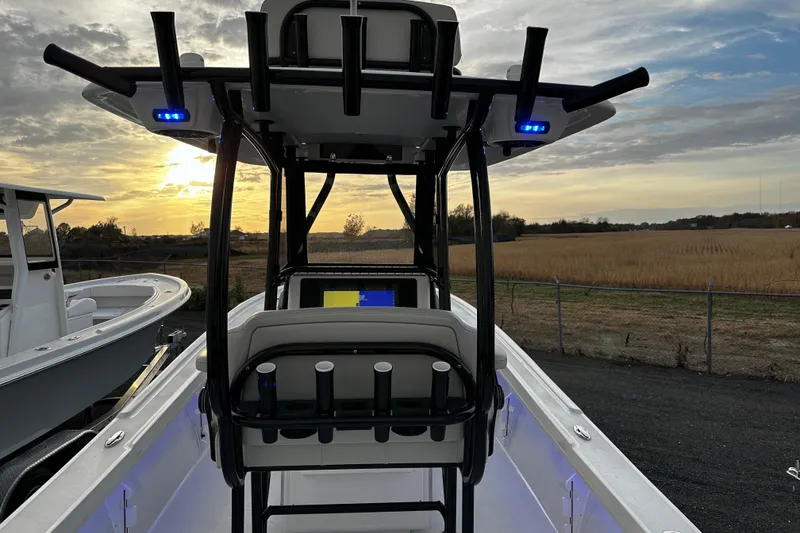 Slide: The Image of 2024 Pair Customs 24DV boat interior with sunset view, featuring modern design and equipment. - 11