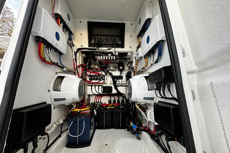 Slide: The Image of Electrical system inside a 2024 Pair Customs 24DV boat, featuring wiring and components. - 29