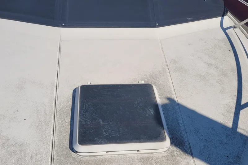 Slide: The Image of Hatch on deck of 1990 Phoenix 29 SFX Convertible boat. - 15