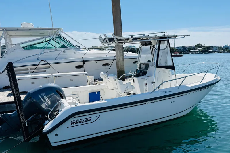 Slide: The Image of 2000 Boston Whaler 21 Outrage boat docked with Yamaha outboard motor. - 3