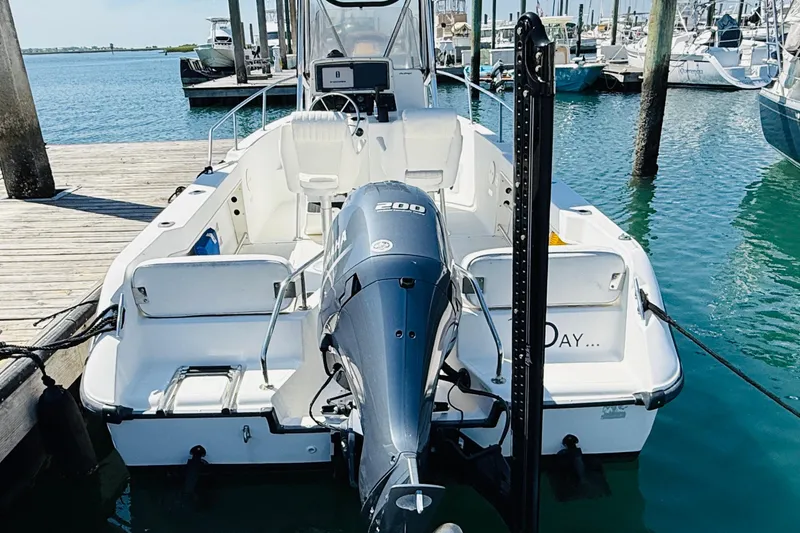 Slide: The Image of 2000 Boston Whaler 21 Outrage boat docked with Yamaha outboard motor. - 7