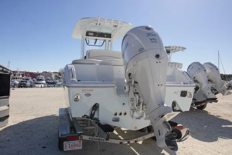 Slide: The Image of 2026 Sea Hunt Ultra 255 SE boat with dual Yamaha 350 engines on a trailer. - 11