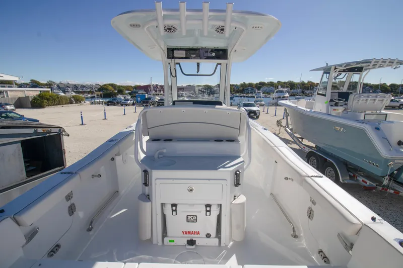 Slide: The Image of 2026 Sea Hunt Ultra 255 SE boat interior with Yamaha cooler, docked at marina. - 7