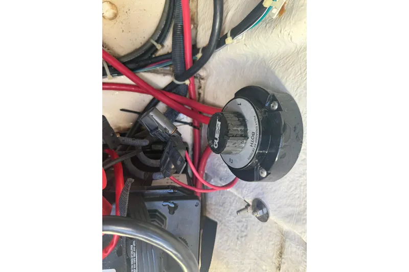Slide: The Image of Close-up of a 2013 Hurricane Sundeck 217 IO boat's electrical wiring and battery switch. - 16
