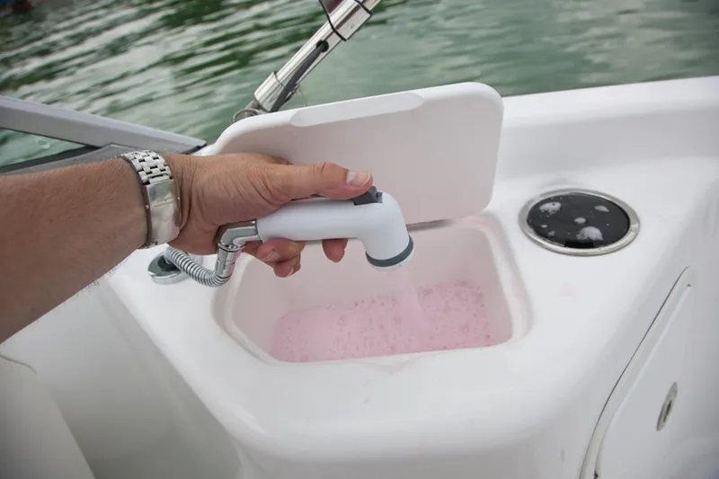 Slide: The Image of 2013 Hurricane Sundeck 217 IO boat interior with beige and blue seating. - 4