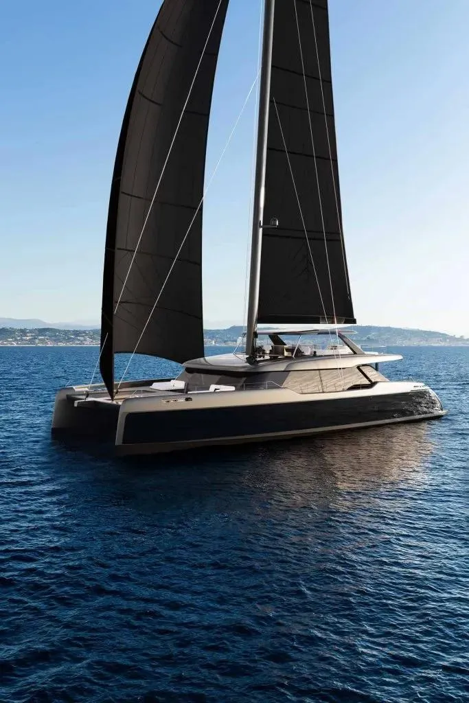 Slide: The Image of Luxury Sunreef 35M yacht sailing on open sea, 2026 model, with sleek black sails. - 4
