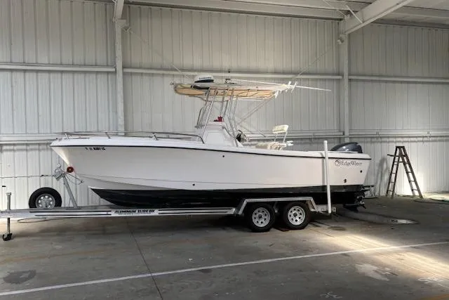 Slide: The Image of 2001 Edgewater 225CC boat on trailer in indoor storage facility. - 4