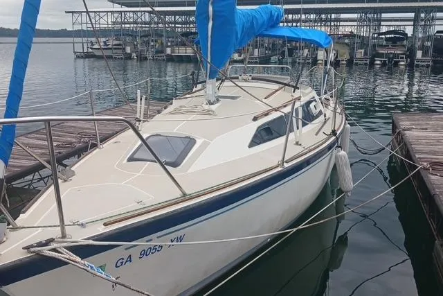 The Image of 1989 O'Day 272 sailboat docked at marina with blue sail cover. - 0