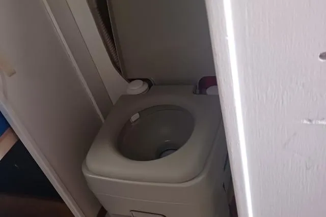 Slide: The Image of Compact marine toilet in 1989 O'Day 272 sailboat bathroom. - 10