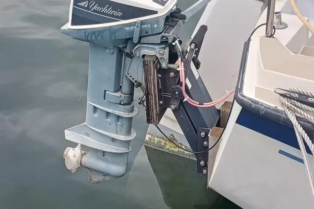 Slide: The Image of 1989 O'Day 272 sailboat with outboard motor attached at the stern. - 6