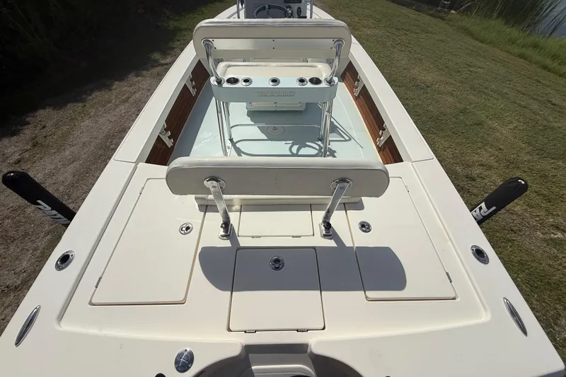 Slide: The Image of 2016 Pathfinder 2300 HPS boat deck with seating and storage compartments. - 12